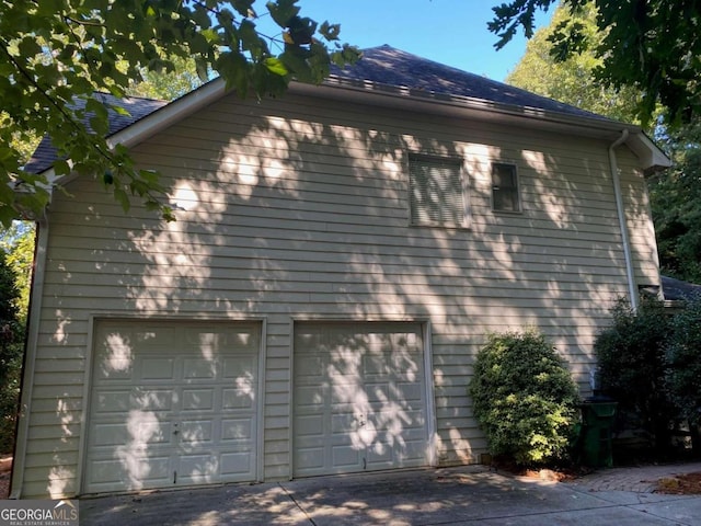 view of side of property featuring a garage