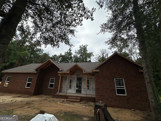 unfinished property with a porch