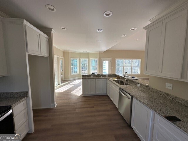 kitchen with sink, dishwasher, white cabinetry, dark hardwood / wood-style floors, and light stone counters