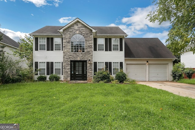 1125 Misty Meadows Ln, Hampton, GA 30228 - colonial-style house featuring stone siding, an attached garage, driveway, and a front lawn