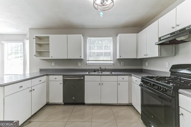 kitchen featuring white cabinets, dishwasher, black range with gas stovetop, light tile patterned flooring, and a textured ceiling