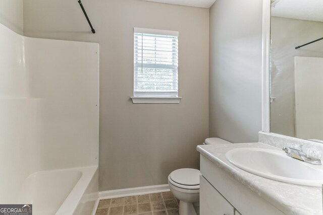 full bathroom with vanity, toilet, washtub / shower combination, and tile patterned flooring