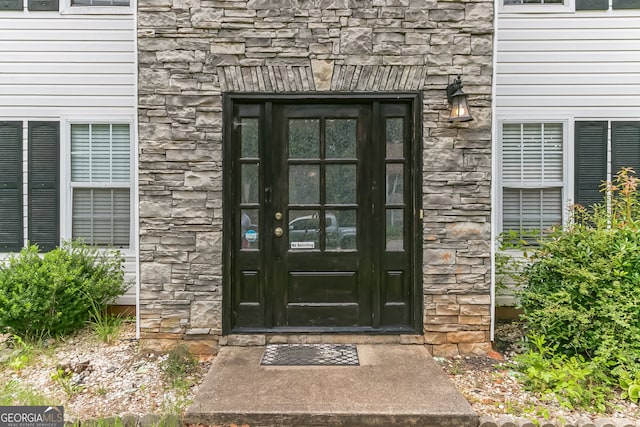 property entrance featuring french doors