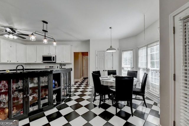 dining space featuring ceiling fan