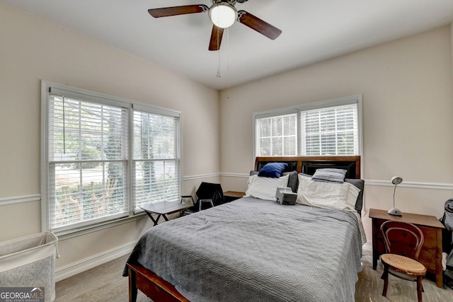 bedroom featuring ceiling fan and light hardwood / wood-style floors