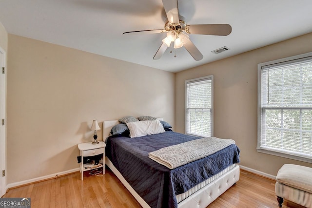 bedroom featuring ceiling fan and light hardwood / wood-style floors