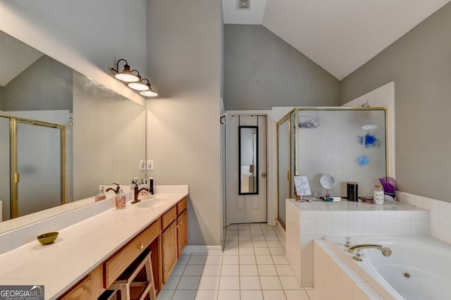 bathroom with vanity, vaulted ceiling, tile patterned floors, and separate shower and tub