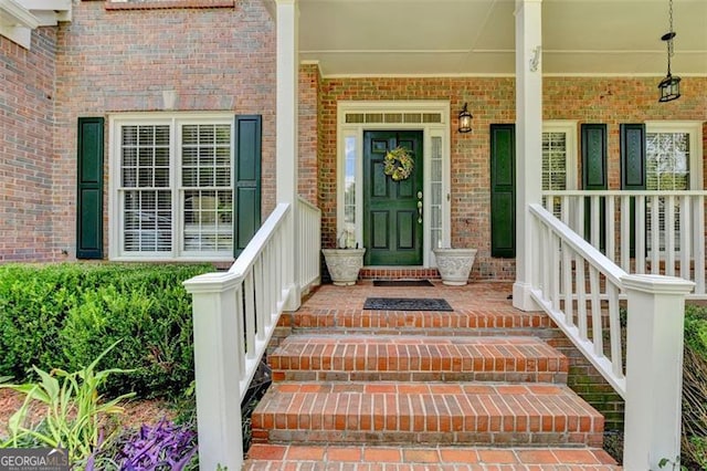 property entrance featuring covered porch