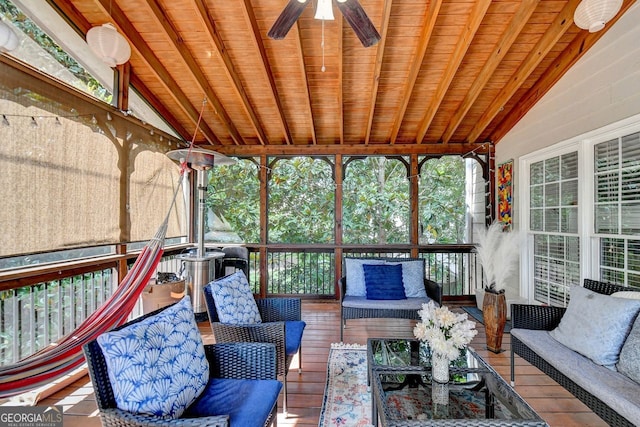 sunroom featuring wood ceiling, ceiling fan, and vaulted ceiling with beams