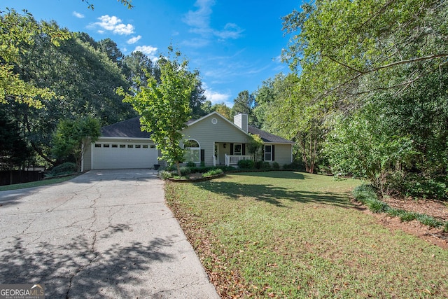 view of front facade featuring a porch, a garage, and a front lawn