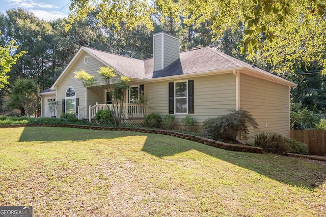 view of front of home with covered porch and a front lawn