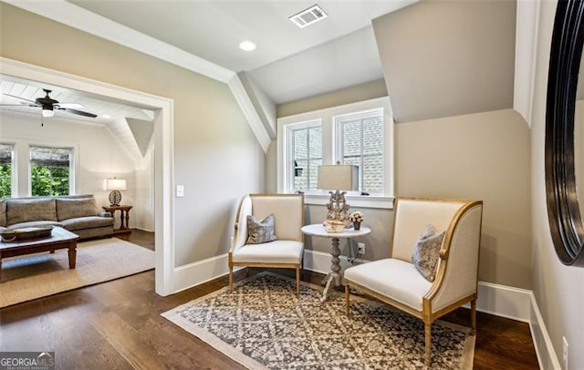 living area with ceiling fan and dark hardwood / wood-style floors