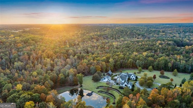 aerial view at dusk with a water view