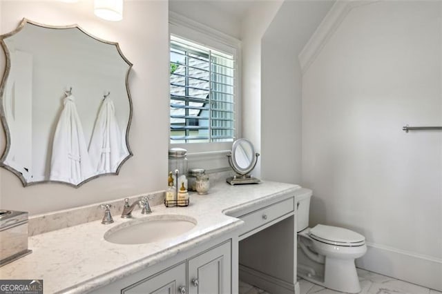 bathroom featuring toilet and vanity