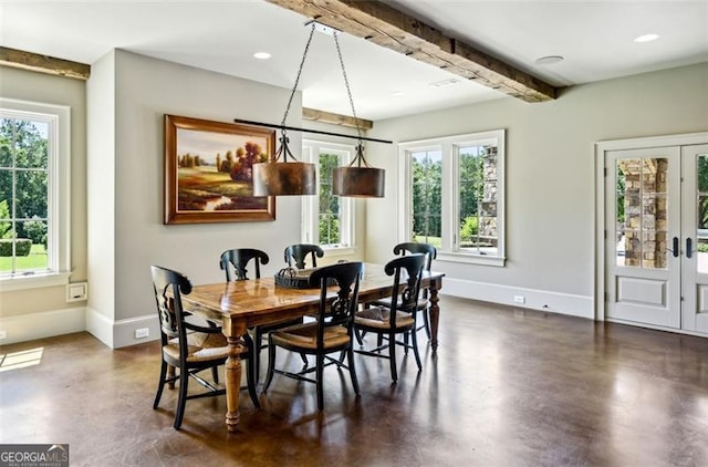 dining area with beamed ceiling and french doors