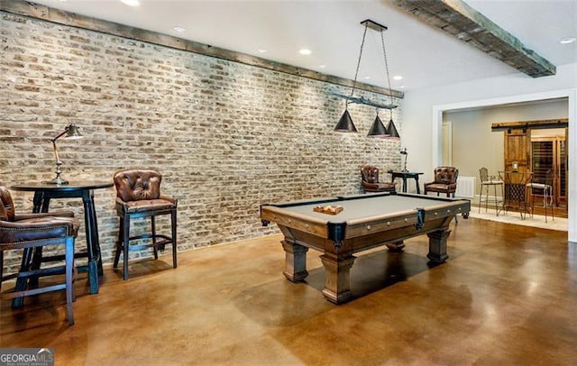 playroom with billiards, brick wall, and a barn door