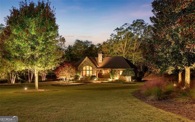 view of front of home with a yard