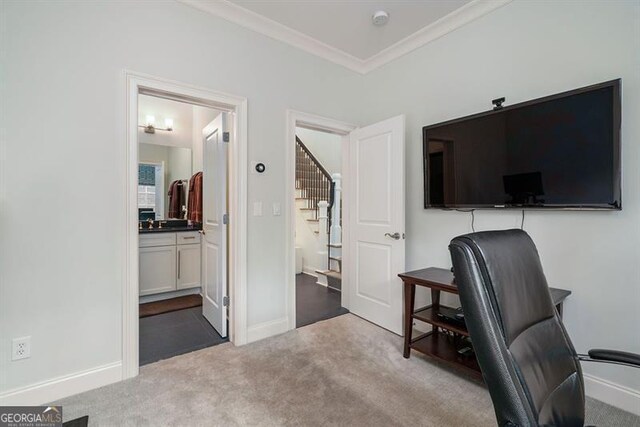 office area with crown molding and light colored carpet