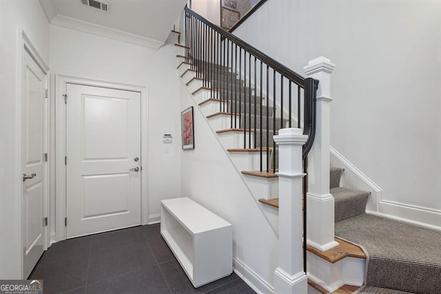 stairs with tile patterned floors