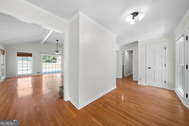 corridor featuring crown molding, hardwood / wood-style flooring, and lofted ceiling with beams