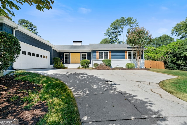 ranch-style house featuring a garage