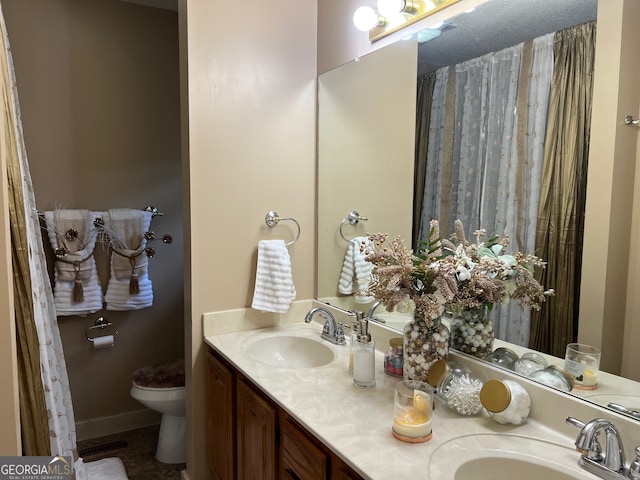 bathroom with vanity and toilet