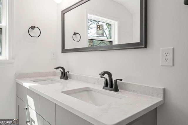 bathroom with vanity and a healthy amount of sunlight