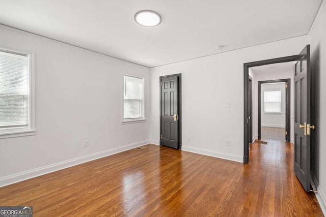 unfurnished bedroom with wood-type flooring