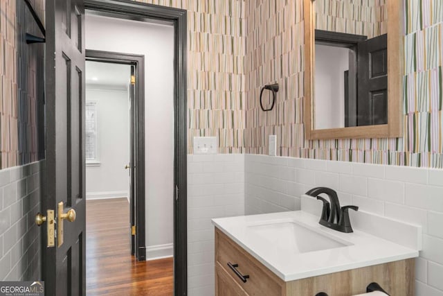 bathroom with vanity and hardwood / wood-style flooring