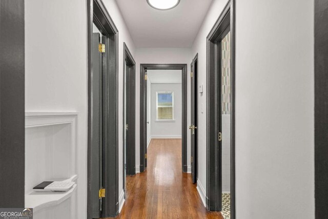 hall featuring dark wood-type flooring