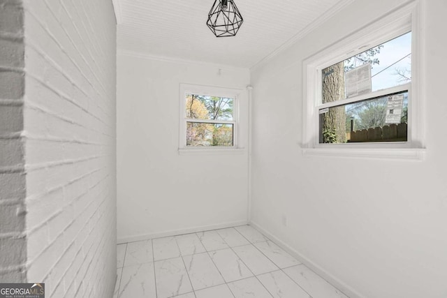 unfurnished room featuring ornamental molding