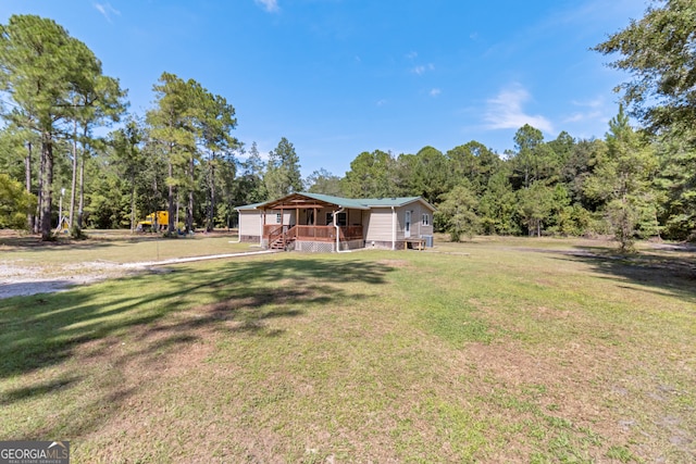 view of yard with covered porch