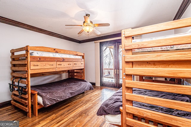 bedroom with crown molding, access to outside, ceiling fan, and dark hardwood / wood-style floors