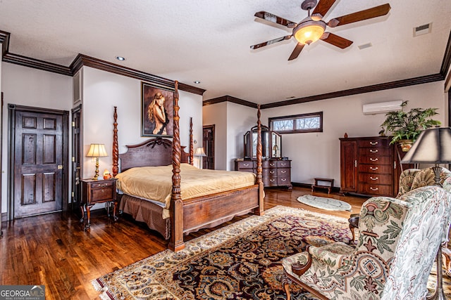 bedroom featuring crown molding, dark wood-type flooring, ceiling fan, an AC wall unit, and a textured ceiling