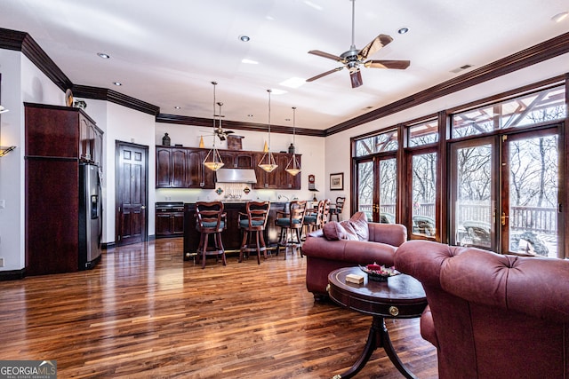 living room featuring french doors, plenty of natural light, ceiling fan, and dark hardwood / wood-style floors