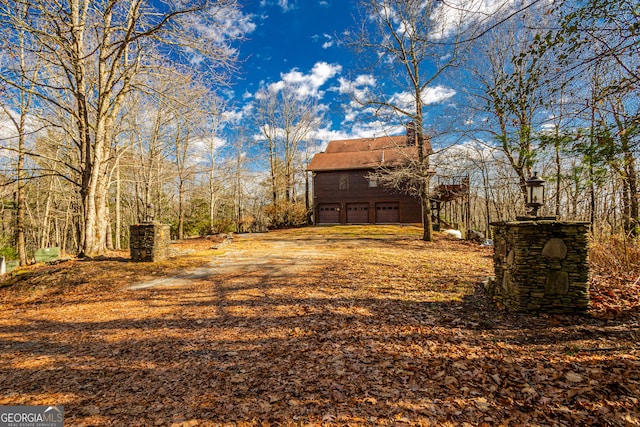 view of yard featuring a garage