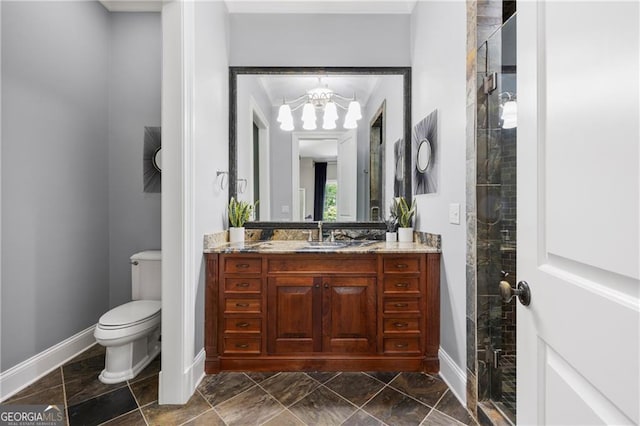 bathroom with a shower with shower door, toilet, a notable chandelier, and vanity