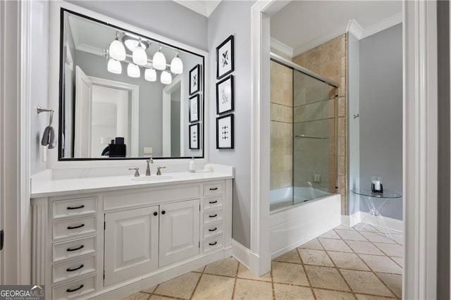 bathroom with crown molding, vanity, and bath / shower combo with glass door