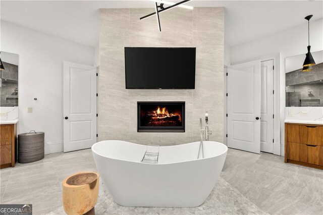 tiled living room with tile walls and a fireplace