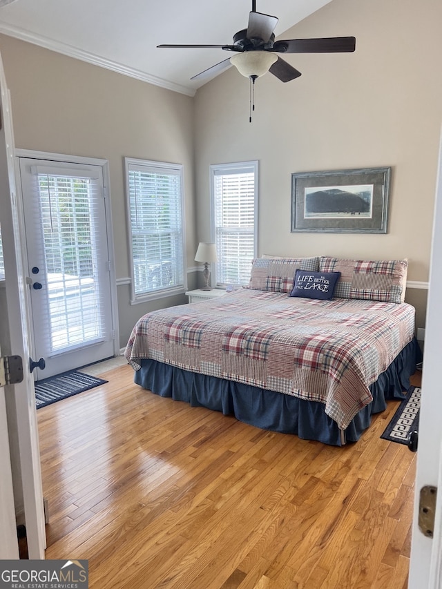 bedroom with light wood-type flooring, multiple windows, ceiling fan, and access to exterior