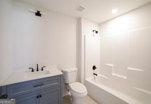 full bathroom with tile patterned flooring, vanity, toilet, and washtub / shower combination