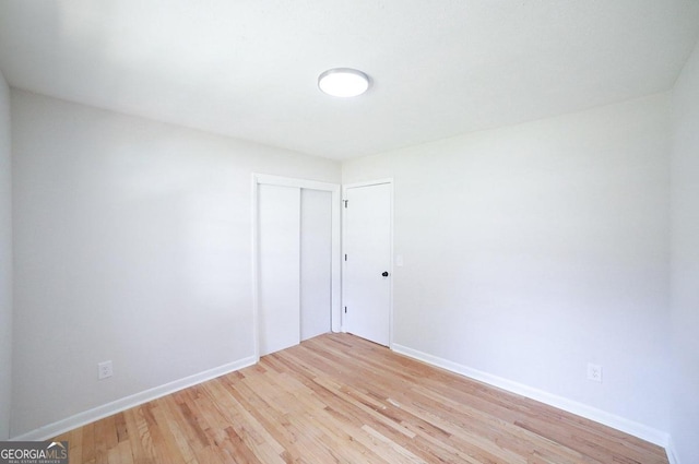 unfurnished room with light hardwood / wood-style flooring