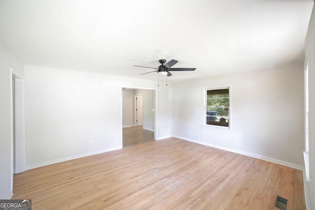 unfurnished room with light hardwood / wood-style flooring and ceiling fan