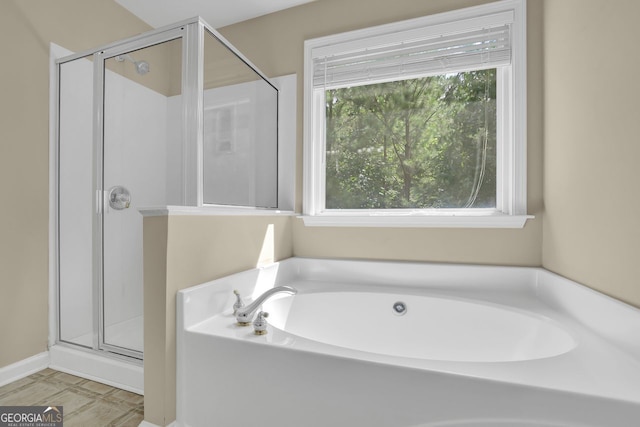 bathroom with shower with separate bathtub