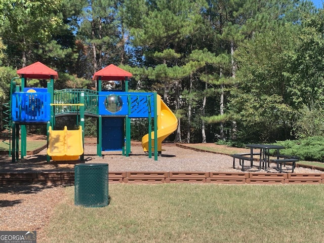 view of playground featuring a lawn