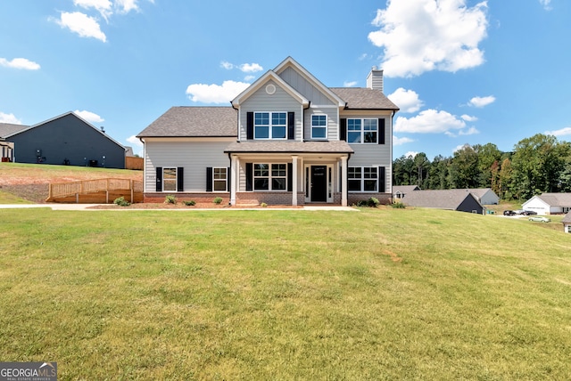 view of front of home featuring a patio and a front lawn