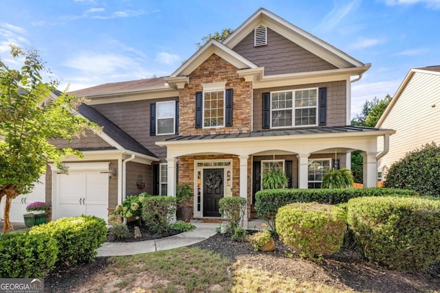 craftsman house with a garage and a porch