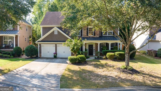 view of front of home featuring a garage, covered porch, and a front yard