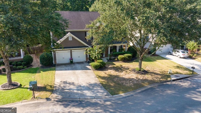 obstructed view of property featuring a garage and a front yard