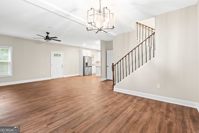 entryway with hardwood / wood-style floors and ceiling fan with notable chandelier